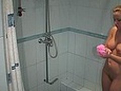 This lusty golden-haired can spend hours in the shower room cause she really feels like water washes down her weariness and adds energy and heat making her ready for wicked games in the presence of spy camera!