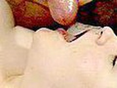 This is the slowest ejaculation you'll ever see. The angel is lying on her back licking and engulfing a guy's cock while he lazily jacks off. Cum trickle into her mouth a not many drops at a time.