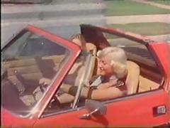 Vintage porn threesome with John Holmes getting his big rod sucked
